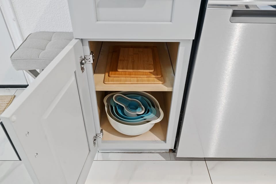 Cutting Boards, Bowls, measuring cups, and strainer