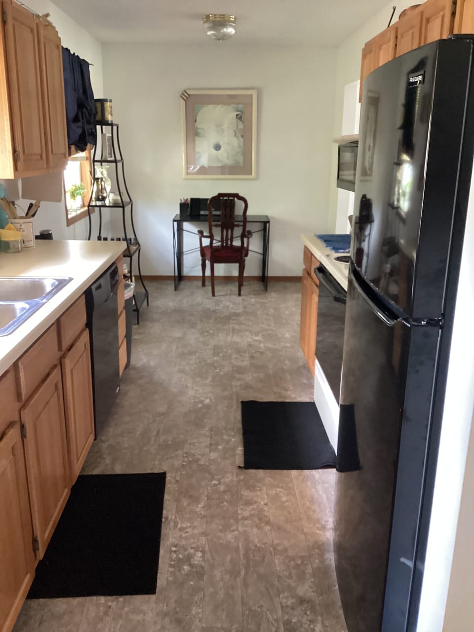 Full size kitchen w/ designated work space.