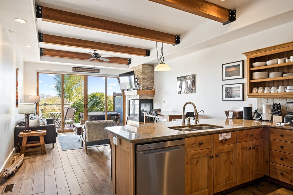 - Open-concept kitchen with granite countertops  
- Fully stocked with stainless steel appliances  
- Perfect for cooking meals and gathering inside