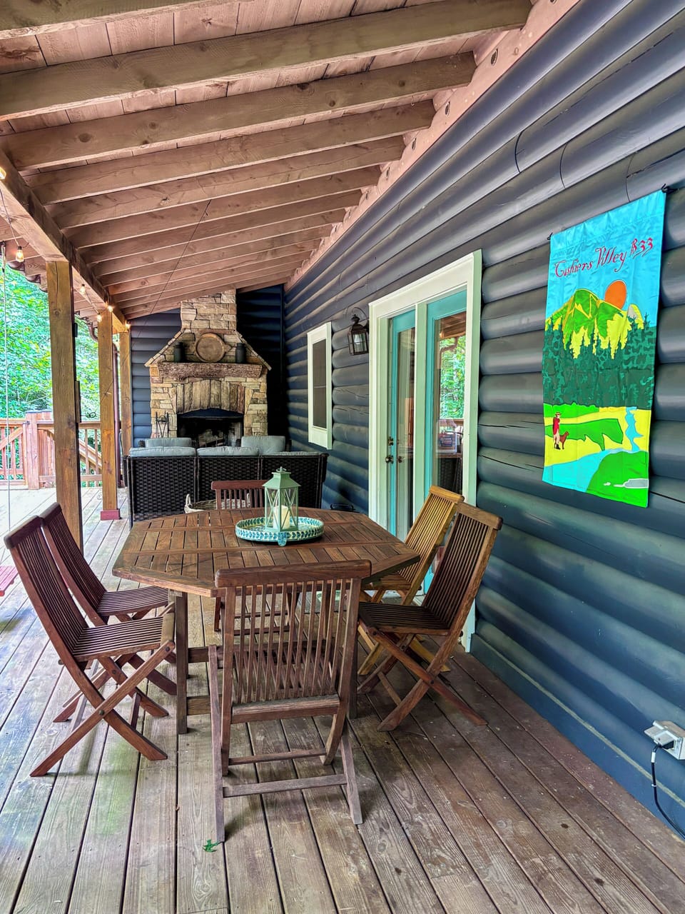Beautiful, expansive back porch with a dining area, grill, & fireside seating