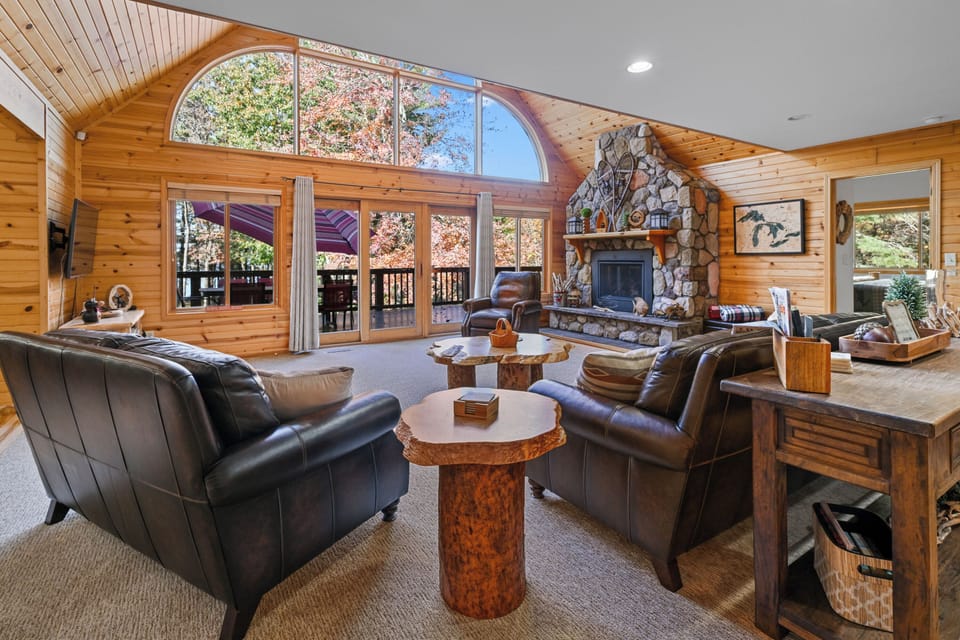 Enjoy this open concept living room overlooking Castle Rock Lake. Warm up during those fall and winter months with the gas fireplace and ample room for the entire family to gather.