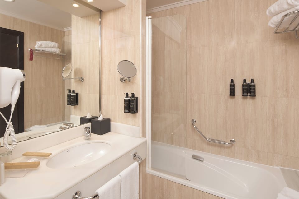 Designer toiletries, hair dryer, bidet, towels