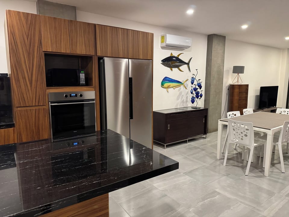Deluxe Condo, Sea View | Private kitchen | Full-size fridge, microwave, oven, cookware/dishes/utensils