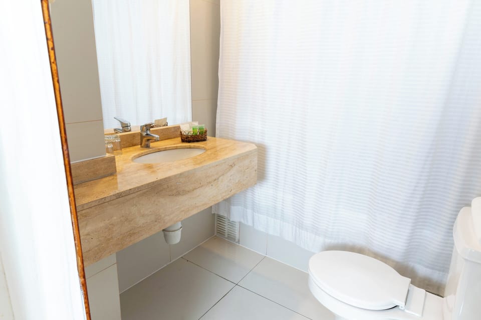 Basic Single Room | Bathroom | Hair dryer, towels, soap, shampoo