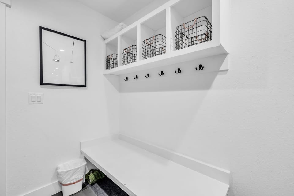 Mud Room: Full-size washer and dryer, storage space, bench, coat hooks, main floor
