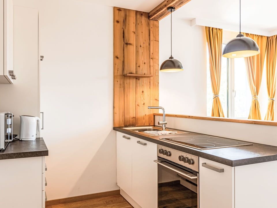 Cabinetry, Countertop, Property, Kitchen Appliance, Kitchen Stove, Building, Kitchen, Wood, Lighting, Drawer