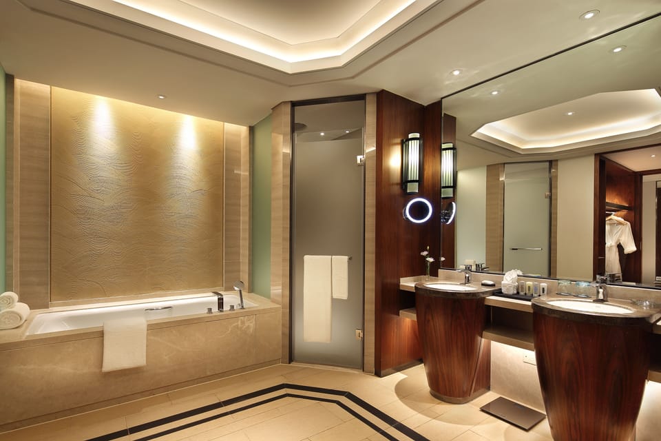 Separate tub and shower, rainfall showerhead, designer toiletries