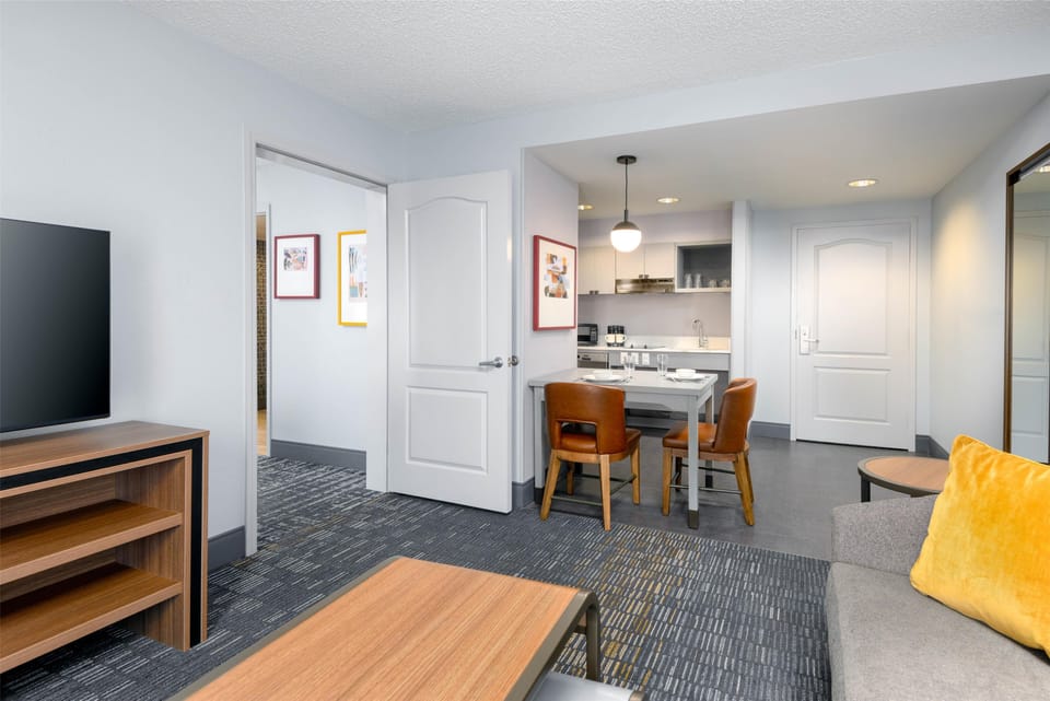 Suite, 2 Queen Beds, Bathtub (Mobility & Hearing, Non Smoking) | Living area | 50-inch TV with satellite channels
