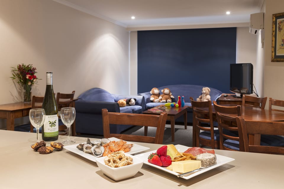 Apartment, 2 Bedrooms | Living area | 32-inch LCD TV with satellite channels, TV, first-run movies