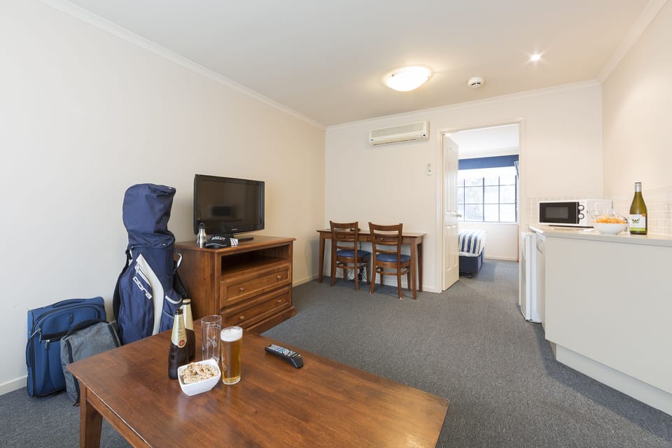 Apartment, 1 Bedroom | Living area | 32-inch LCD TV with satellite channels, TV, first-run movies