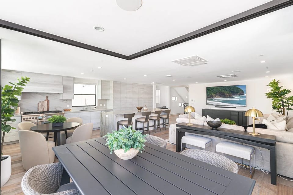 Sophisticated dining and living space with modern finishes, designer details, and an inviting open layout
                