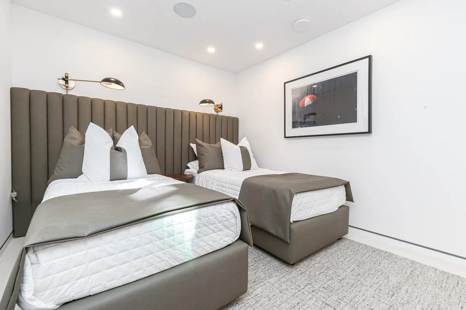 Stylish dual-beds and ample space create the perfect setting for guests seeking additional sleeping arrangements
                