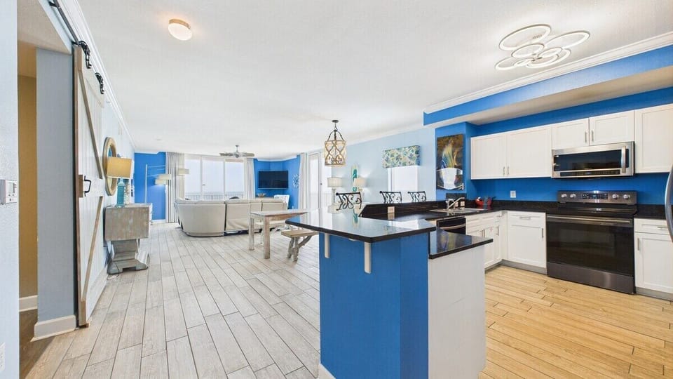 Open concept living area with full kitchen