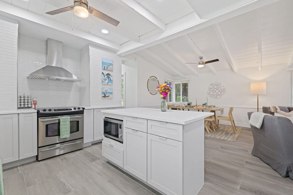 Bright and modern open-concept kitchen seamlessly connects to the dining and living areas, ideal for cooking and gathering with loved ones.