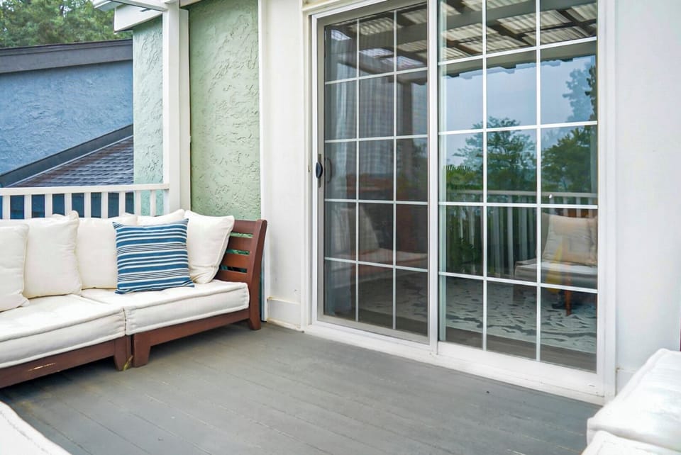 Step out onto the master balcony and take in serene views in Goose Creek.