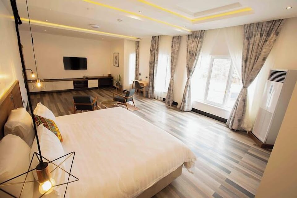 Deluxe Room, Balcony, City View | Desk, laptop workspace, free WiFi