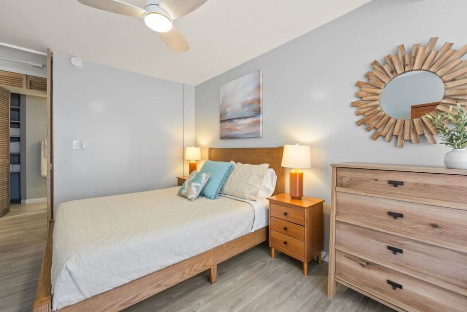 Sweet dreams await in our tranquil bedrooms—both featuring queen beds and sliding doors to the lanai!