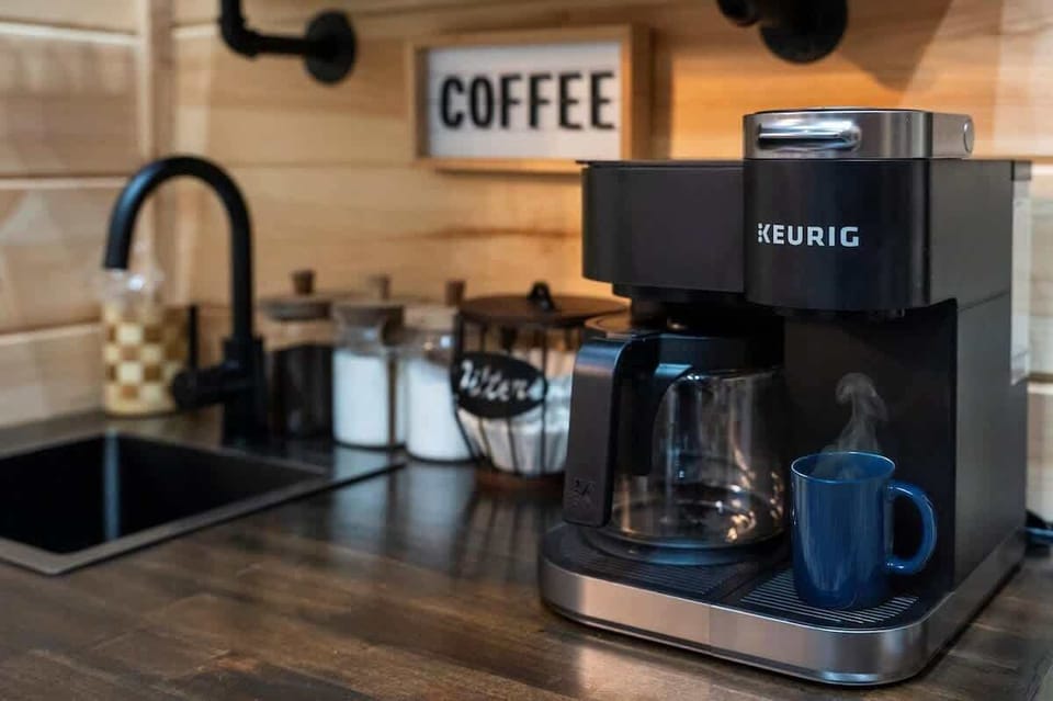 Enjoy our coffee station—grounds, pods, creamer, and sugar included.