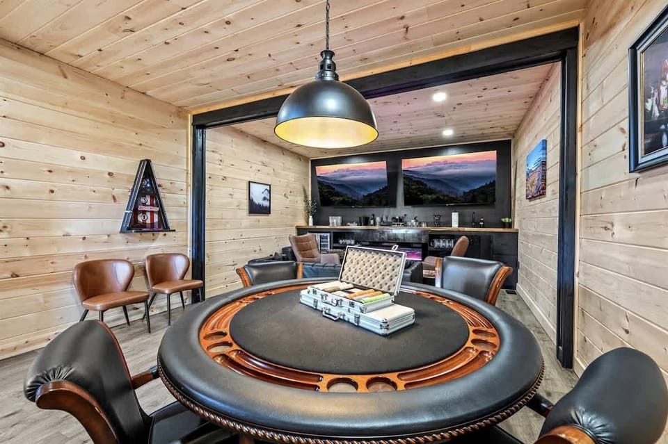 Speakeasy-style room with poker table for friendly competitions.