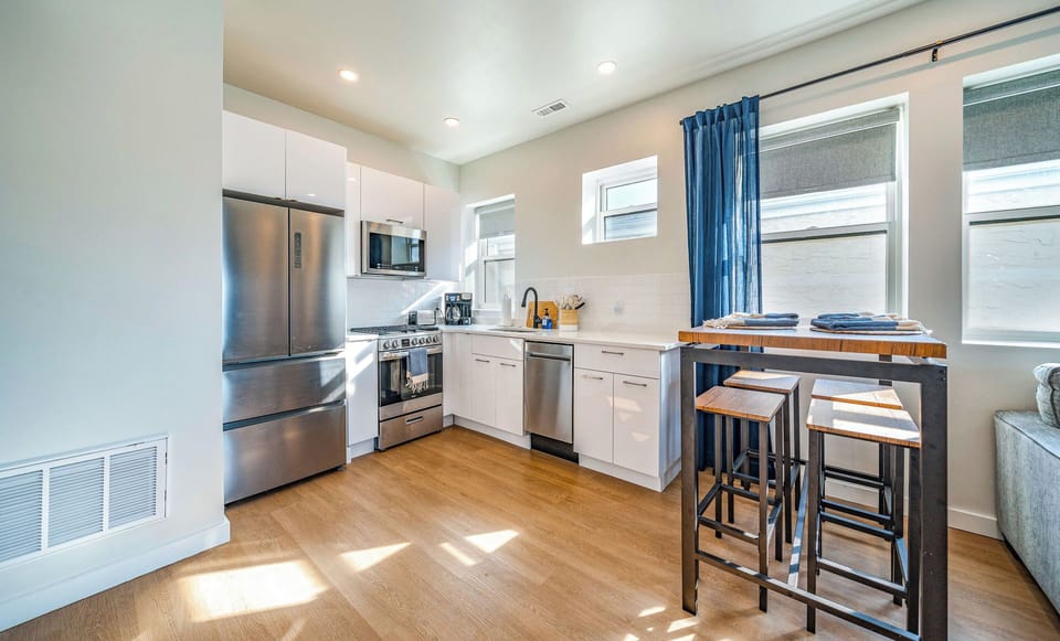 Functional kitchen with stainless steel appliances and bar seating