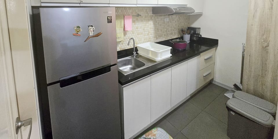 Luxury Condo, 2 Bedrooms, Balcony, Garden View | Private kitchen | Electric kettle, toaster, rice cooker, cleaning supplies