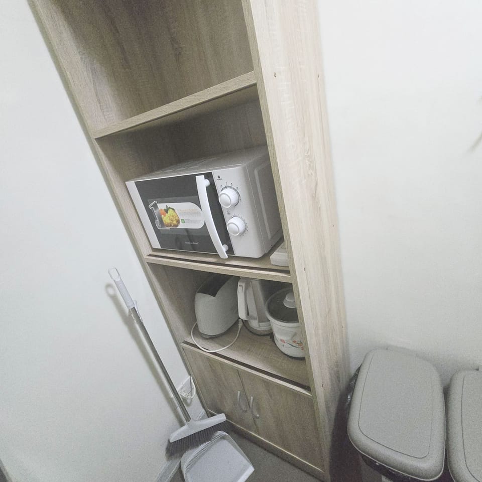 Luxury Condo, 2 Bedrooms, Balcony, Garden View | Private kitchen | Electric kettle, toaster, rice cooker, cleaning supplies