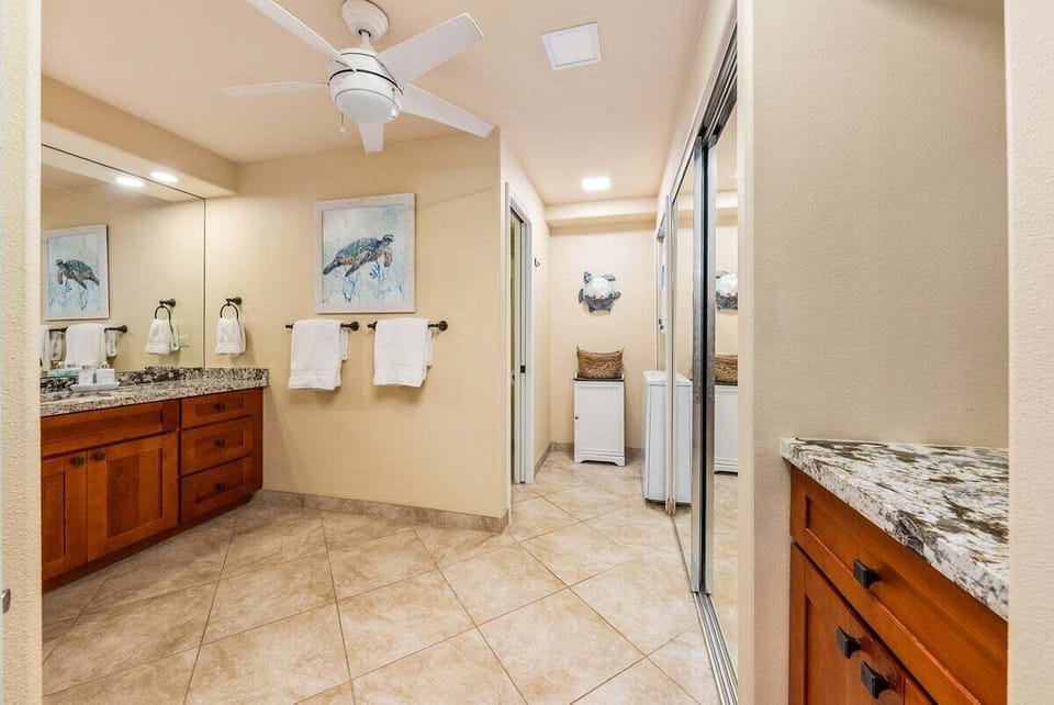 Full bathroom with tiled shower and vanity