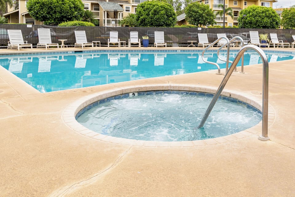Pool and spa conveniently resides just across the building entrance