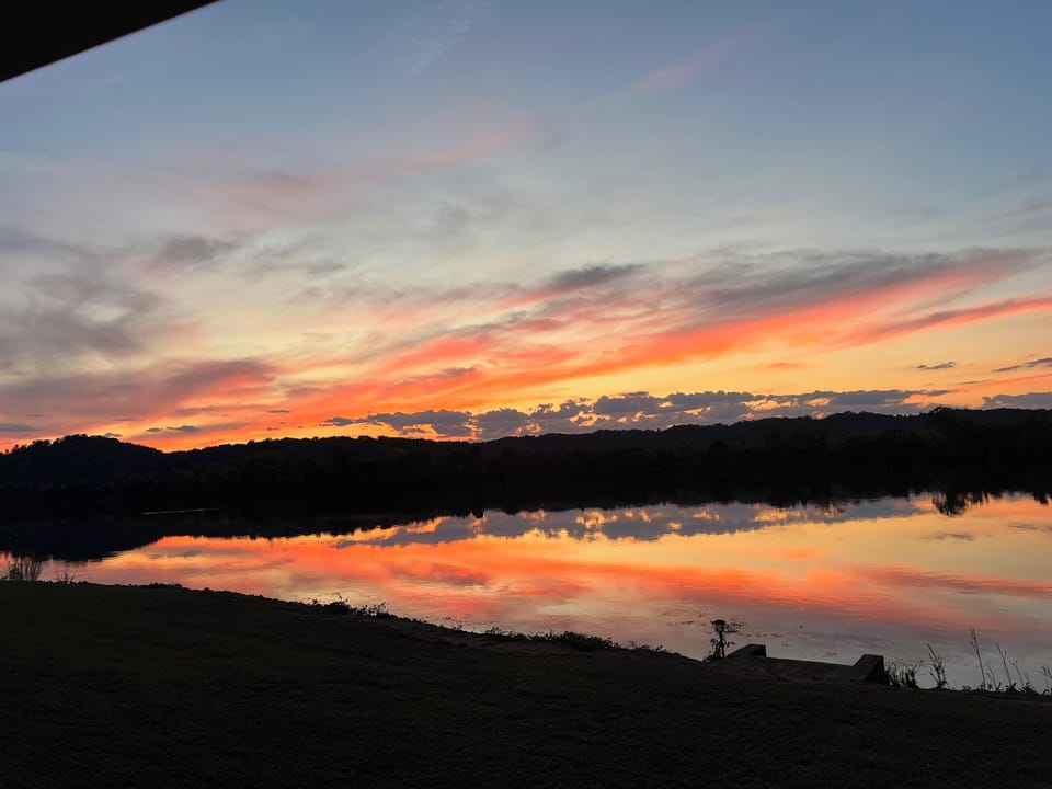 Sunsets over the water here are a myriad of majestic colors in the east TN sky.