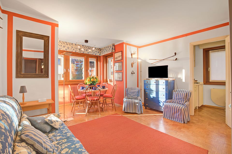 Family Apartment, 2 Bedrooms, Balcony (Appartamento Fraiteve Ski In Ski Out) | Living area | Flat-screen TV