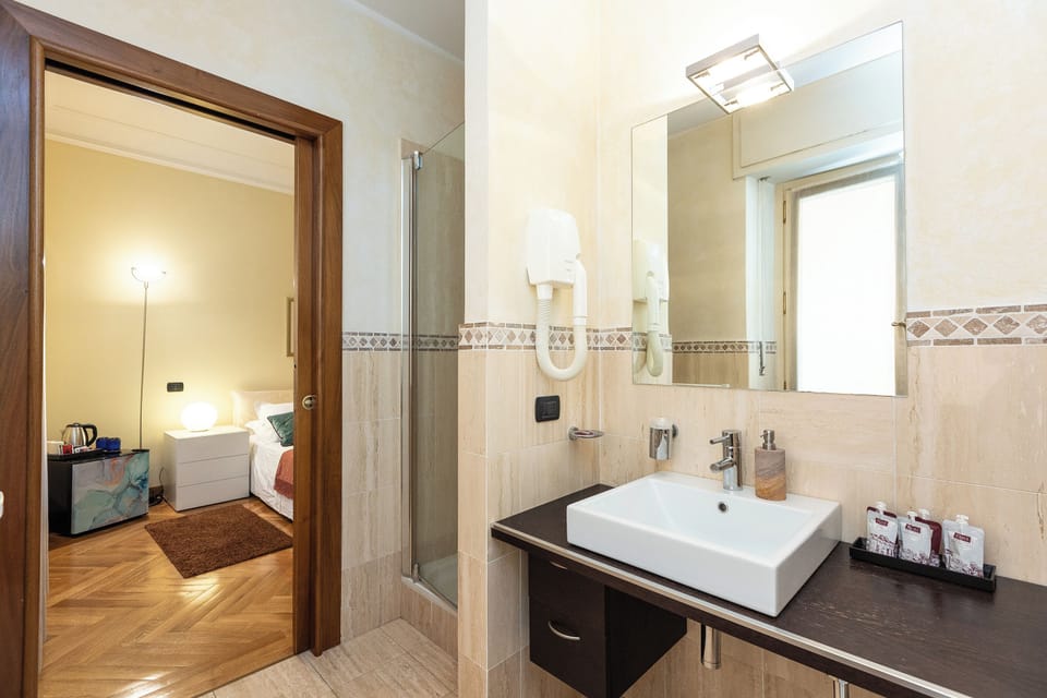 Superior Double Room, City View | Bathroom | Shower, hair dryer, slippers, towels