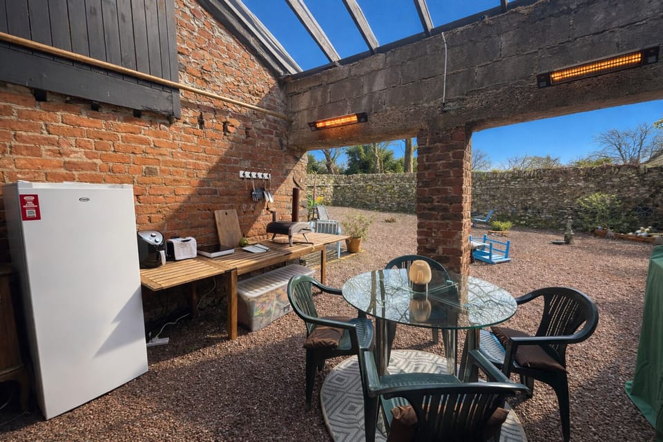 Outdoor kitchen and dining area in the private courtyard