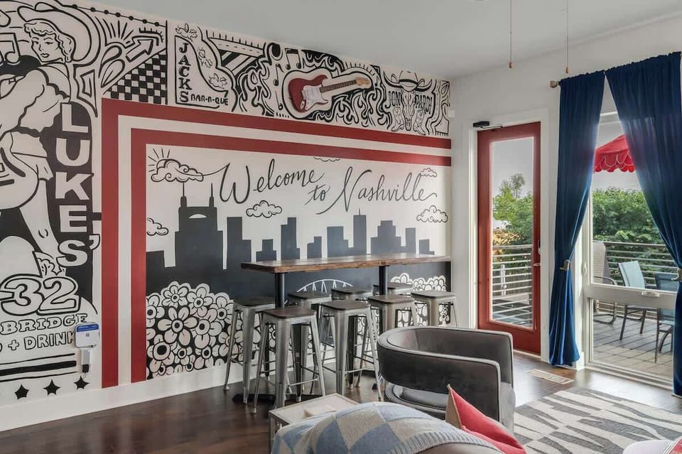Artistic mural complemented by sleek seating and vibrant views of Nashville!