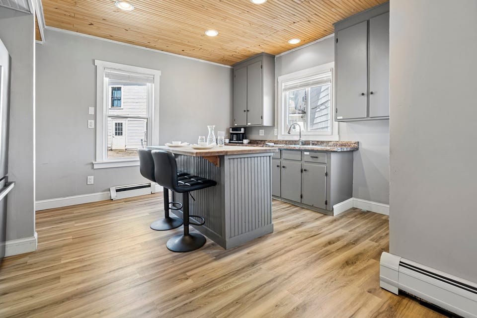 Kitchen with island and barstools