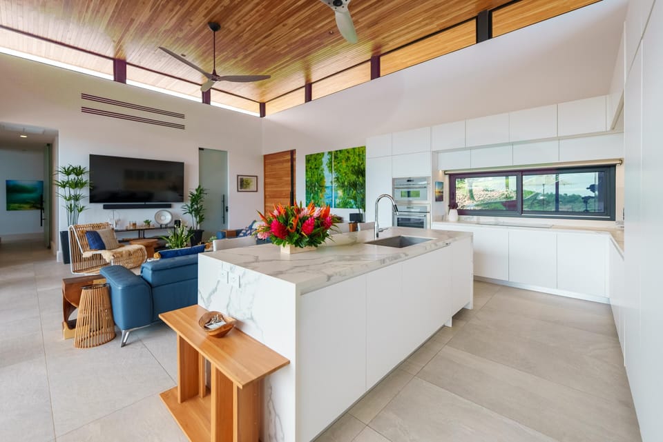 The kitchen and social areas flow seamlessly together, and form the core of the bio-climatic design