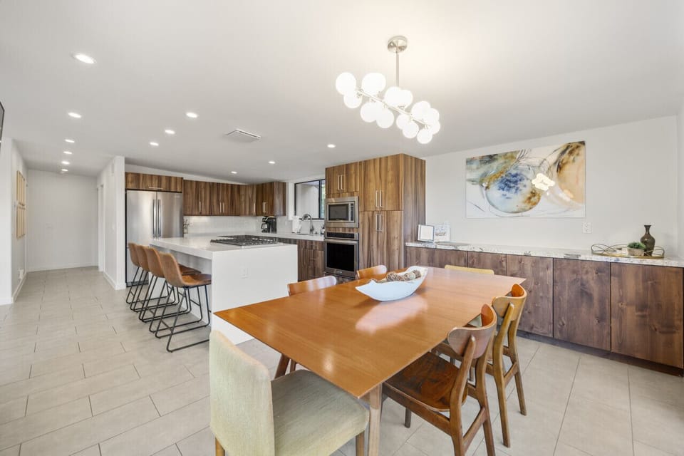 The dining table in the kitchen has seating for six