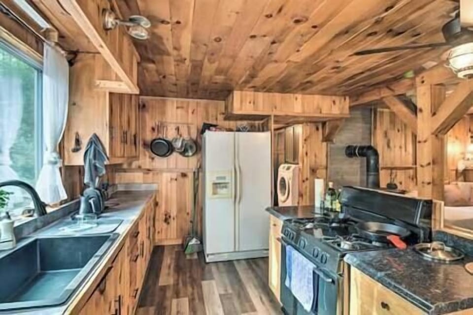 Alternative view of kitchen with large basin style sink.