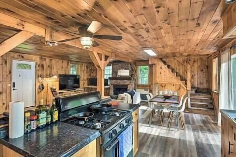 Kitchen is fully stocked with gas stove, spices, oils, plates, bowls, cups, and all utensils.