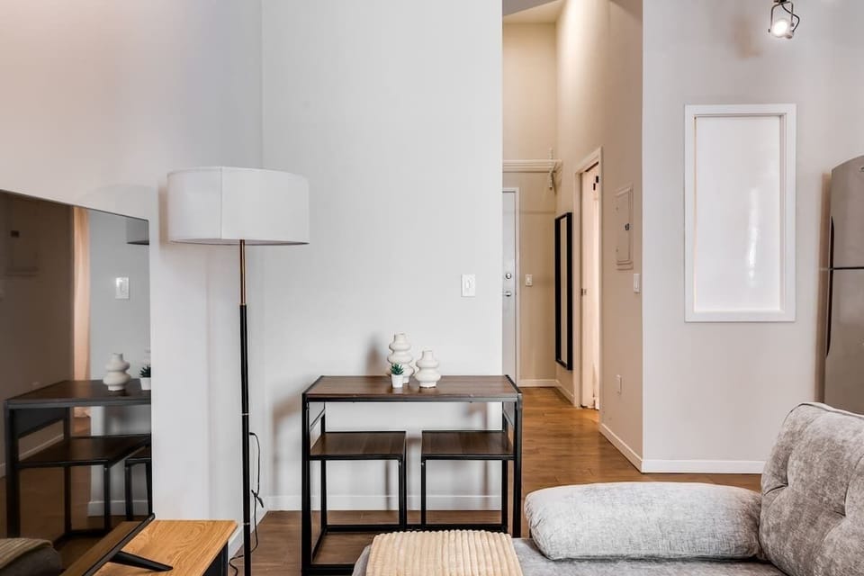 Minimalist workspace with sleek decor, perfect for work or enjoying your coffee.