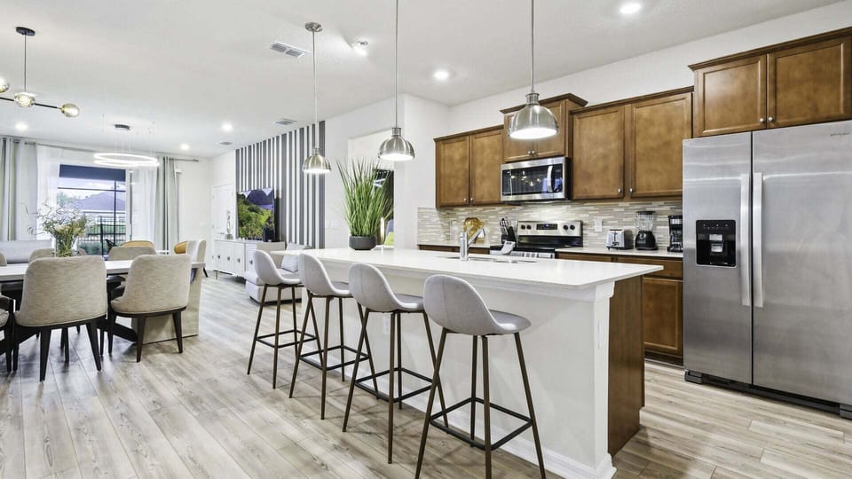 The kitchen features stainless steel appliances with all you need to prepare delicious meals.