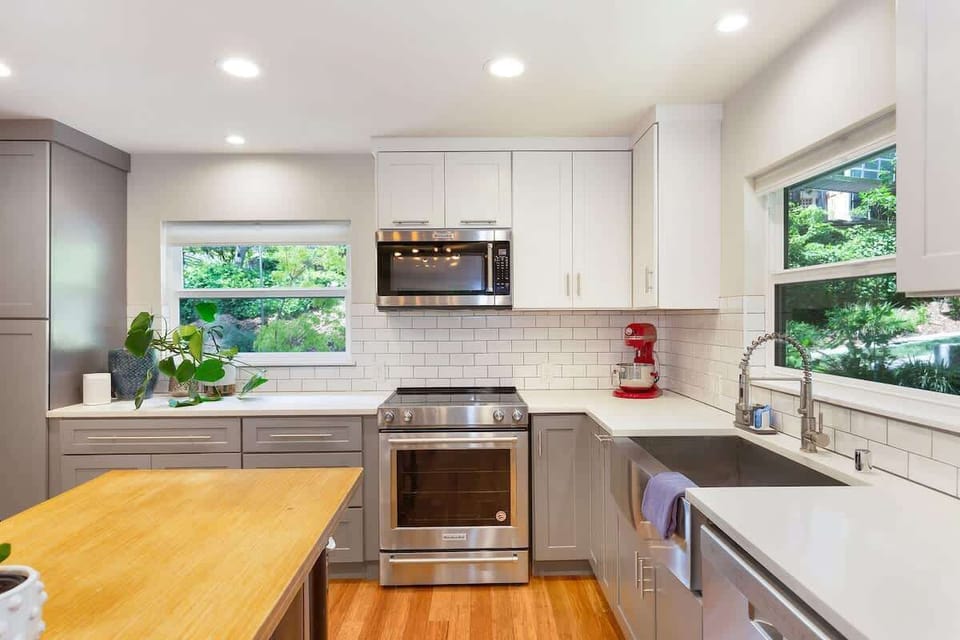 Bright kitchen with view of trees. Cook a full meal or just grab coffee and go.