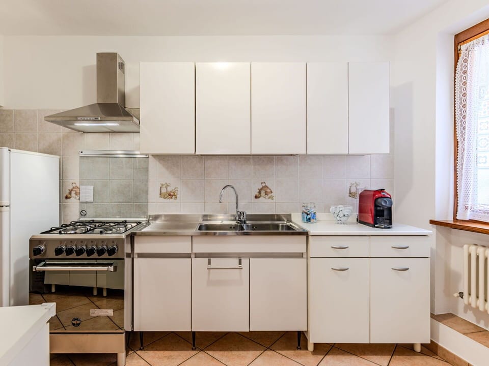 Cabinetry, Property, Countertop, Sink, Kitchen Sink, Kitchen, Kitchen Stove, Window Blind, Interior Design, Building