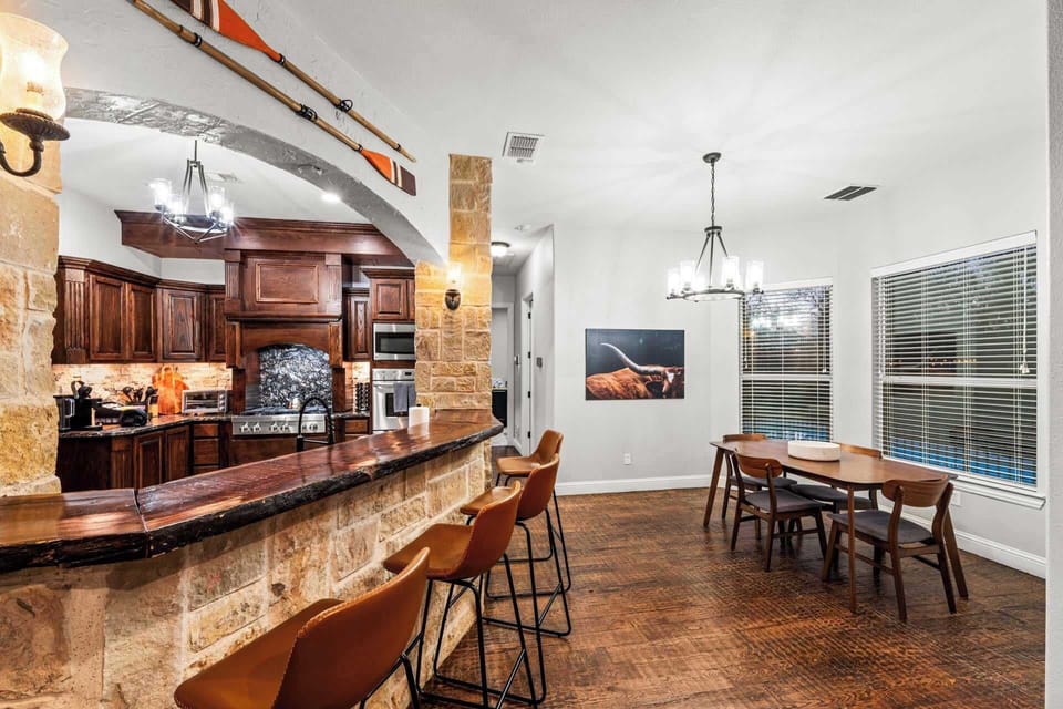 Gather around! Our large kitchen island with high seating is perfect for cooking, chatting, and sipping coffee, with a dining area just steps away for full meals.