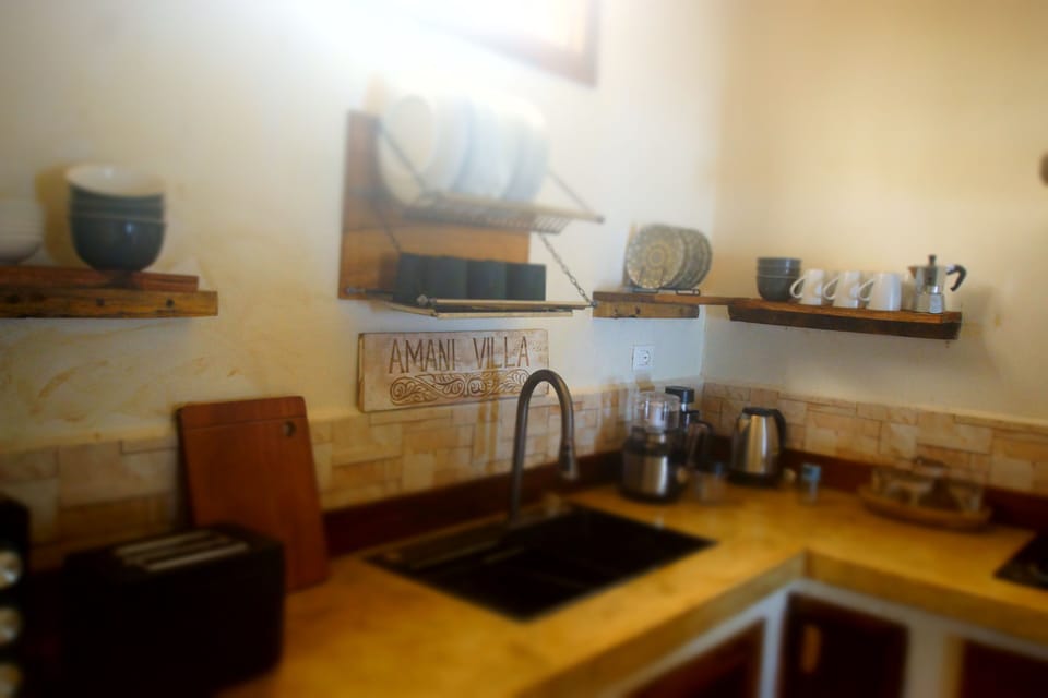 Deluxe Villa, Ocean View | Private kitchen | Highchair