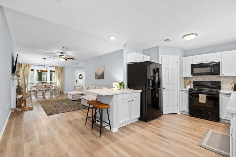 Kitchen open to the living area and has a small table top for others to hang out and chat. 
