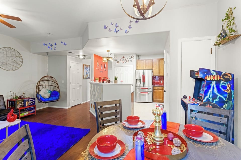 Spacious and open-concept living area with a cozy sitting nook and a fully equipped kitchen. Perfect for entertaining guests or enjoying a quiet night in.