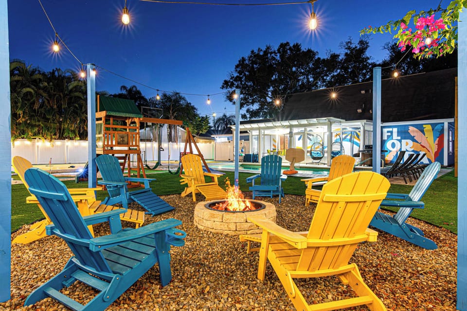Backyard firepit, kids' play area, and saltwater pool