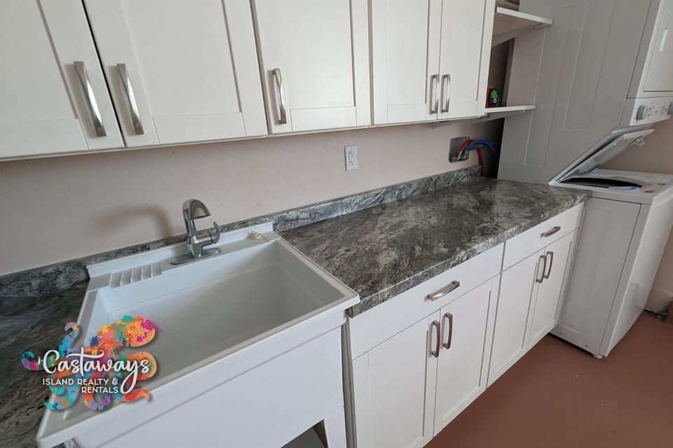 Laundry - Located in Garage, with utility sink