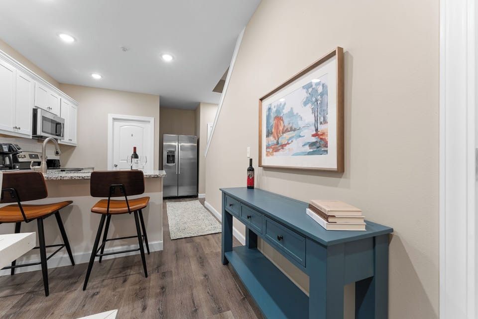 Chic bar stools and decor make this kitchen nook cozy and inviting.