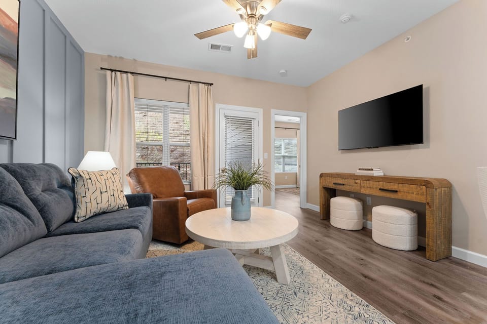 Cozy up in this inviting living room with soft lighting and plush seating.